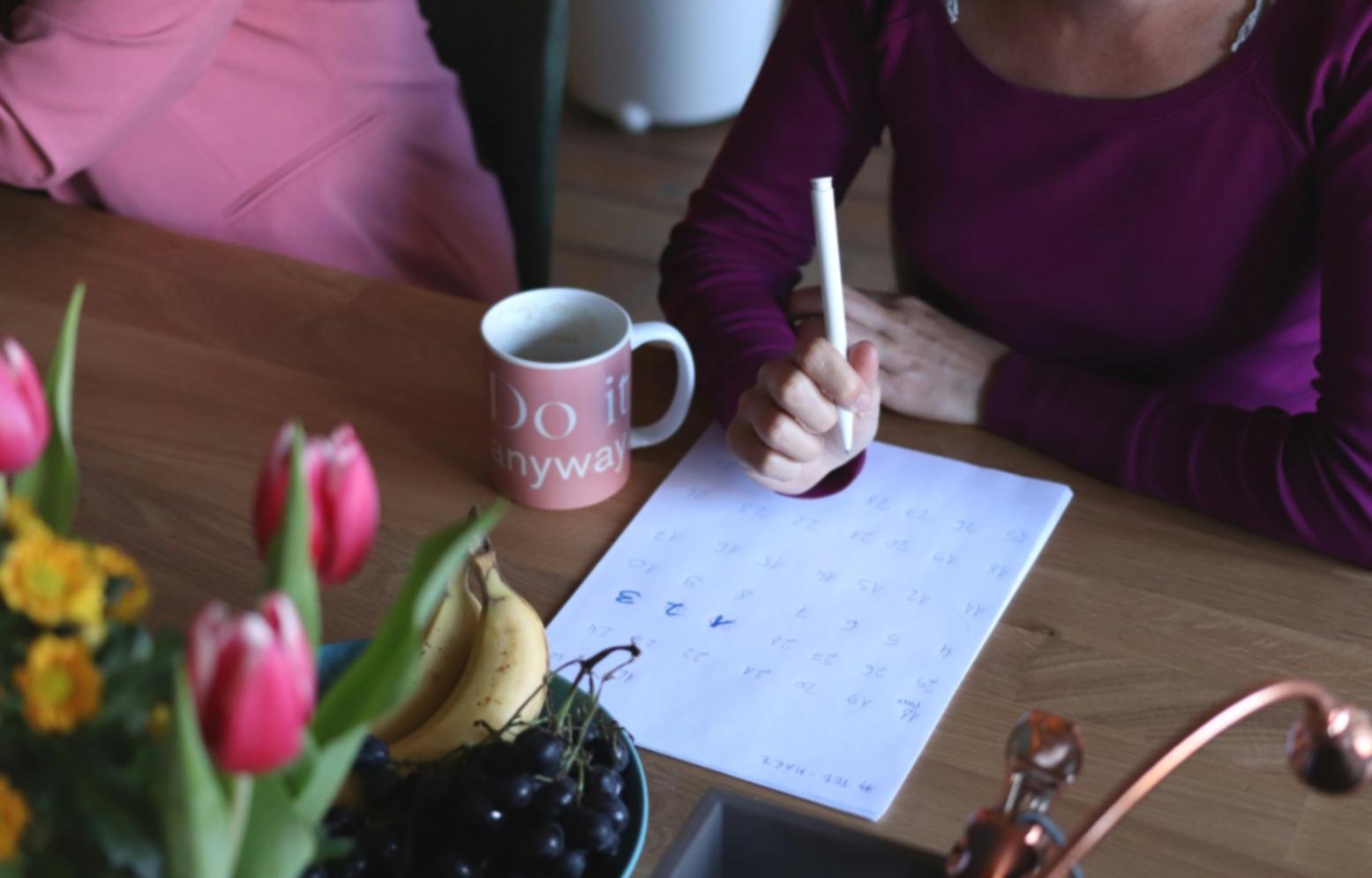 Student analyzing financial calendars on computer screen