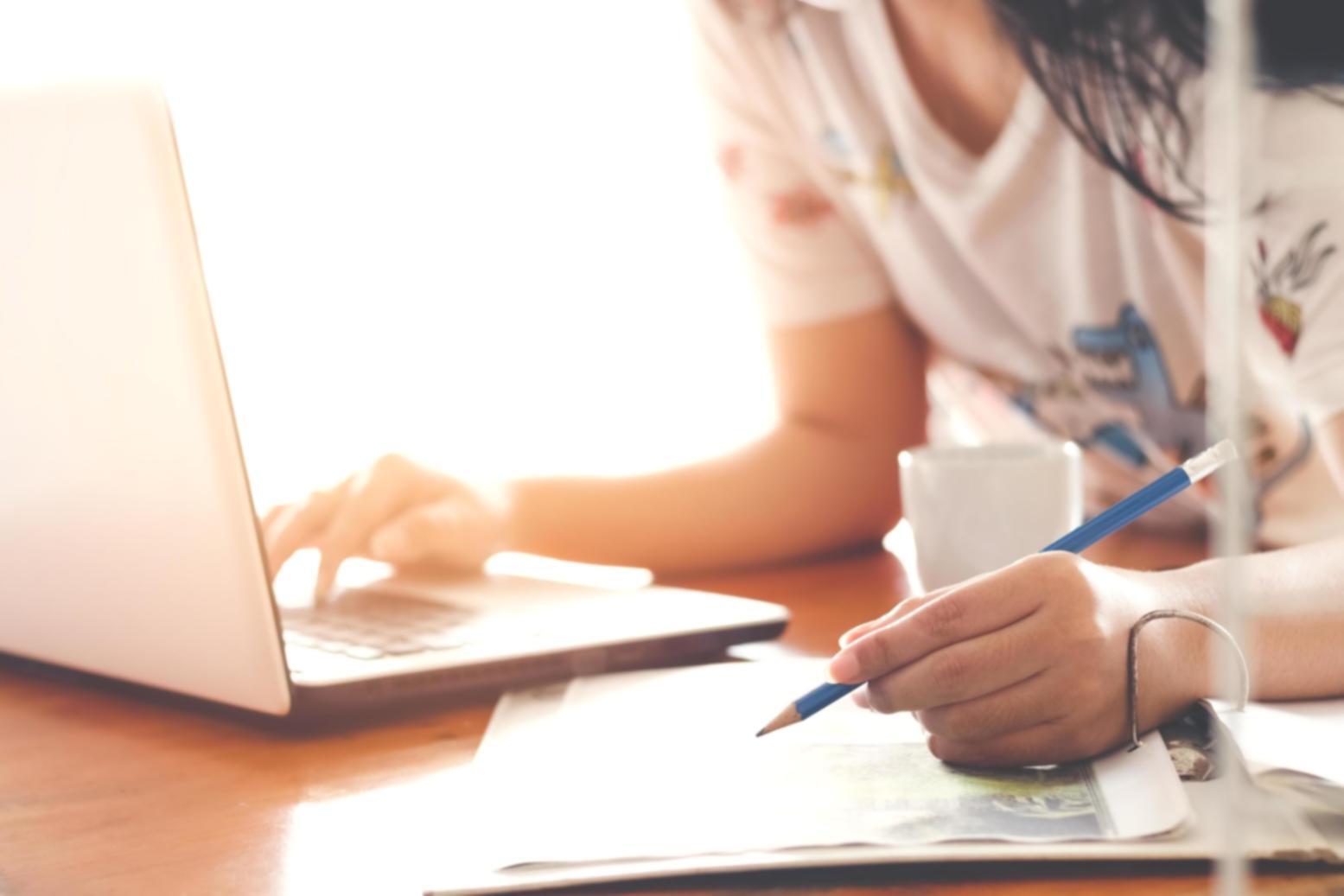 Financial documents and calendars on desk showing investment tracking